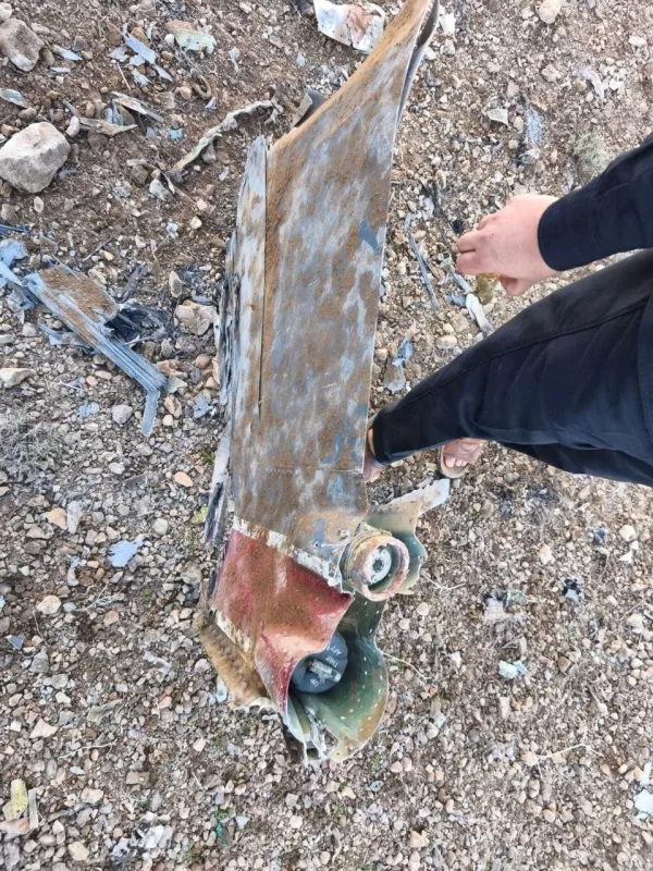 The Iranian state media said to show fragments of a downed U.S. jet in this picture said to be taken in central Iran and released on April 3, 2026. IRNA/Handout via REUTERS  THIS IMAGE HAS BEEN SUPPLIED BY A THIRD PARTY. IRAN OUT. NO COMMERCIAL OR EDITORIAL SALES IN IRAN. NO USE BBC PERSIAN. NO USE VOA PERSIAN. NO USE MANOTO. NO USE IRAN INTERNATIONAL. NO USE RADIO FARDA. REFILE - CORRECTING FROM "JETS" TO "JET" VERIFICATION: -Reuters was not able to confirm the location or date when the photos were taken. - Type of aircraft could not be verified, but William Goodhind, a forensic imagery analyst with Contested Ground, told Reuters that the plane's tail fin seen in the photos is consistent with that of a F-15E Strike Eagle. -The red stripe seen on the tail fin of the plane in the photos is consistent with the tail section of a F-15E Strike Eagle seen in file photos. -A U.S. official told Reuters on April 3 that a U.S. fighter jet was shot down over Iran.