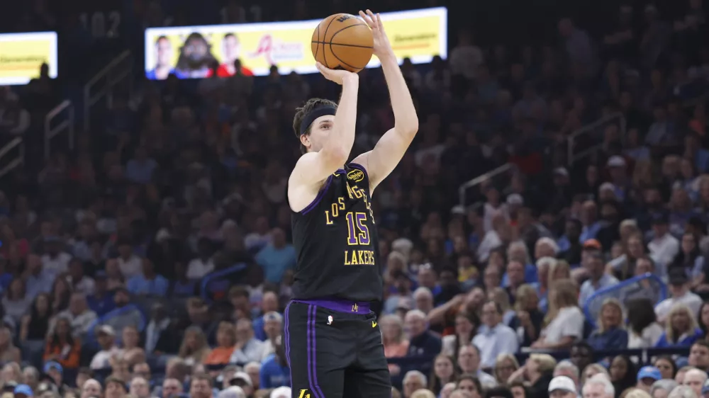 Apr 2, 2026; Oklahoma City, Oklahoma, USA; Los Angeles Lakers guard Austin Reaves (15) shoots a three point basket against the Oklahoma City Thunder during the first quarter at Paycom Center. Mandatory Credit: Alonzo Adams-Imagn Images
