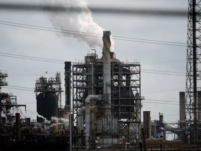 The Shell Norco petroleum refinery and the Valero St. Charles oil refinery are seen in Norco, La., Thursday, April 2, 2026. (AP Photo/Gerald Herbert)