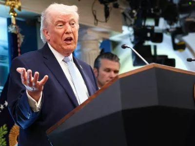FILE PHOTO: U.S. President Donald Trump, flanked by Secretary of Defense Pete Hegseth, speaks during a press conference in the James S. Brady Press Briefing Room at the White House in Washington, D.C., U.S., April 6, 2026. REUTERS/Kevin Lamarque/File Photo