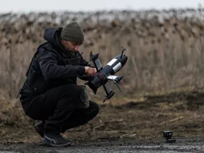 Yuriy, a service member of an air defence unit of the 420th Khort Separate Unmanned Systems Battalion prepares a P1-Sun FPV interceptor drone for a launch during his combat shift, amid Russia's attack on Ukraine, in Kharkiv region, Ukraine March 18, 2026. REUTERS/Valentyn Ogirenko