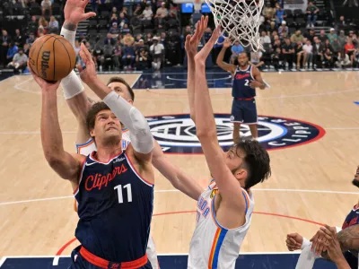 Apr 8, 2026; Inglewood, California, USA; Oklahoma City Thunder center Chet Holmgren (7), center Isaiah Hartenstein (55) defend a shot by Los Angeles Clippers center Brook Lopez (11) in the first half at Intuit Dome. Mandatory Credit: Jayne Kamin-Oncea-Imagn Images