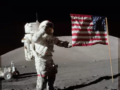 6261520 Astronaut Eugene A. Cernan, Apollo 17 commander, is photographed next to the deployed United States flag during lunar surface extravehicular activity (EVA) at the Taurus-Littrow landing site. The highest part of the flag appears to point toward our planet Earth in the distant background, 1972 (photo). No Use Germany. No Use Italy.