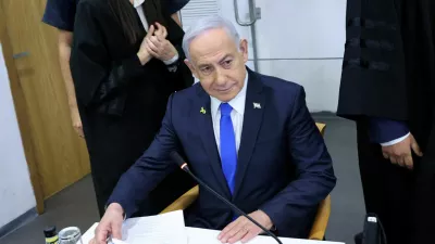 FILE PHOTO: Israeli Prime Minister Benjamin Netanyahu attends his trial on corruption charges at the district court in Tel Aviv, Israel, 21 April, 2025.  Moti Kimchi/Pool via REUTERS/File Photo
