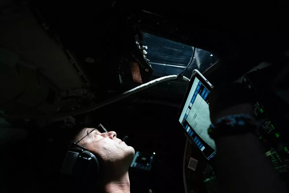 This image provided by NASA, astronaut and Artemis II Commander Reid Wiseman takes a moment during the seven-hour lunar observation period where the crew reported to the ground team their observations including color nuances, which will help enhance scientific understandings of the Moon on Monday, April 6, 2026.  (NASA via AP)