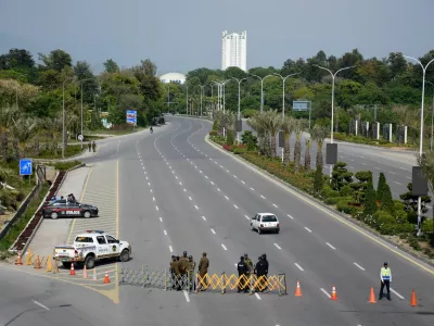 Members of security personnel stand guard on a road leading to the Serena Hotel as delegations from the United States and Iran are expected to hold peace talks, in Islamabad, Pakistan, April 11, 2026. REUTERS/Waseem Khan