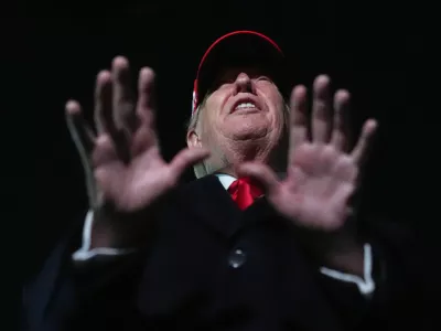 President Donald Trump speaks with reporters at Joint Base Andrews, Md., Sunday, April 12, 2026, after he returned from Miami. (AP Photo/Julia Demaree Nikhinson)