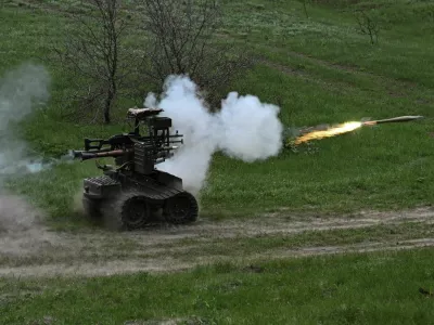 Ukrainian servicemen fire an RPG-7 grenade launcher mounted on an unmanned ground vehicle during testing at a training ground near a front line, amid Russia's attack on Ukraine, in Zaporizhzhia region, Ukraine April 10, 2026. REUTERS/Stringer