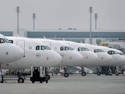 Lufthansa aircraft are parked at an airport as Lufthansa pilots are on a two-day strike in Munich, Germany, Monday, April 13, 2026. (AP Photo/Matthias Schrader)