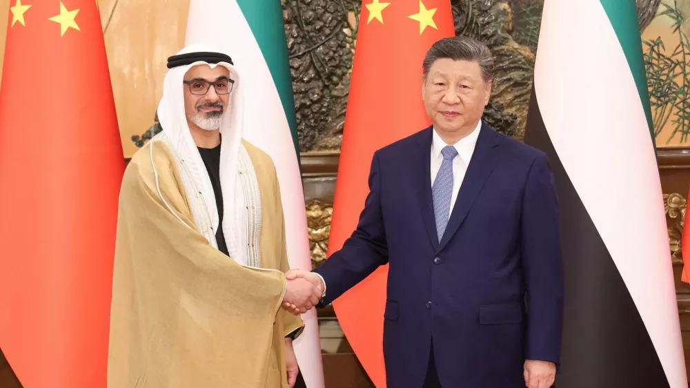 China's President Xi Jinping shakes hands with Sheikh Khaled bin Mohamed bin Zayed Al Nahyan, Crown Prince of Abu Dhabi, United Arab Emirates, in Beijing, China, April 14, 2026. cnsphoto via REUTERS ATTENTION EDITORS - THIS IMAGE WAS PROVIDED BY A THIRD PARTY. CHINA OUT. NO COMMERCIAL OR EDITORIAL SALES IN CHINA