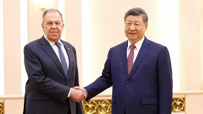 Chinese President Xi Jinping and Russia's Foreign Minister Sergei Lavrov shake hands at the Great Hall of the People in Beijing, China April 15, 2026.  China Daily via REUTERS ATTENTION EDITORS - THIS PICTURE WAS PROVIDED BY A THIRD PARTY. CHINA OUT. NO COMMERCIAL OR EDITORIAL SALES IN CHINA.   TPX IMAGES OF THE DAY