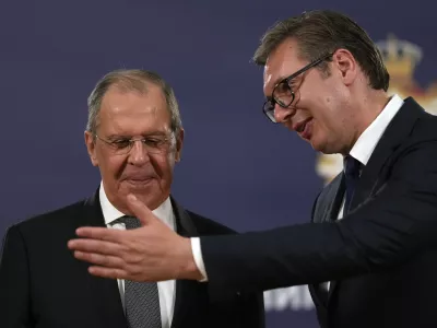 FILE - Russian Foreign Minister Sergey Lavrov, left, speaks with Serbia's President Aleksandar Vucic after a press conference in Belgrade, Serbia, Sunday, Oct. 10, 2021. Serbia says that a planned visit Monday, June 6, 2022 by Russia's foreign minister to the Balkan country will not take place. The announcement followed reports that Serbia's neighbors, Bulgaria, North Macedonia and Montenegro refused to allow Sergey Lavrov's plane to fly through their airspace to reach Serbia. (AP Photo/Darko Vojinovic, File)