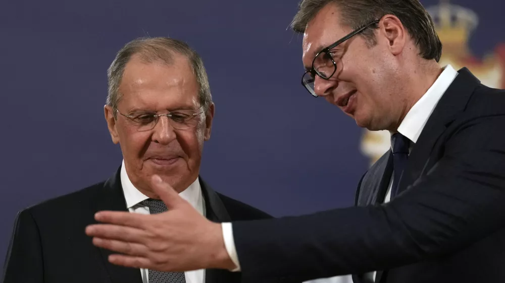FILE - Russian Foreign Minister Sergey Lavrov, left, speaks with Serbia's President Aleksandar Vucic after a press conference in Belgrade, Serbia, Sunday, Oct. 10, 2021. Serbia says that a planned visit Monday, June 6, 2022 by Russia's foreign minister to the Balkan country will not take place. The announcement followed reports that Serbia's neighbors, Bulgaria, North Macedonia and Montenegro refused to allow Sergey Lavrov's plane to fly through their airspace to reach Serbia. (AP Photo/Darko Vojinovic, File)