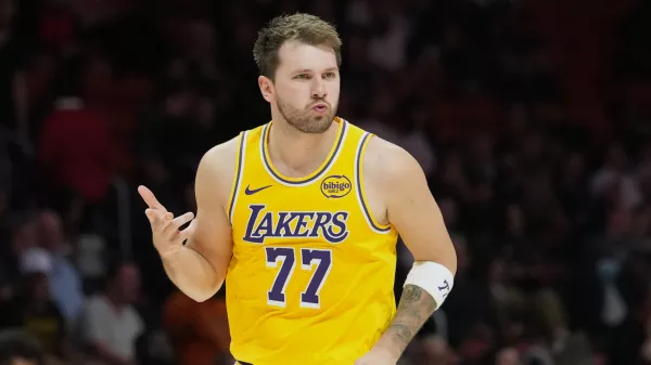 Los Angeles Lakers guard Luka Doncic (77) reacts after scoring during the second half of an NBA basketball game against the Miami Heat, Thursday, March 19, 2026, in Miami. (AP Photo/Lynne Sladky)