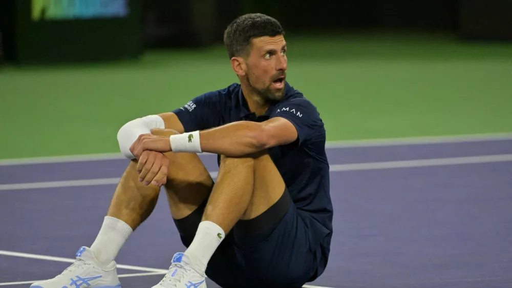 FILE PHOTO: Mar 11, 2026; Indian Wells, CA, USA; Novak Djokovic (SRB) takes a moment on the court after a long rally during his fourth round match against Jack Draper (GBR) in the BNP Paribas Open at the Indian Wells Tennis Garden. Mandatory Credit: Jayne Kamin-Oncea-Imagn Images/File Photo