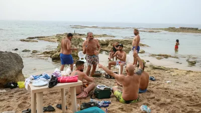 Locals celebrate at the beach, after the 10-days ceasefire between Israel and Lebanon, in Tyre, south Lebanon, April 17, 2026. REUTERS/Louisa Gouliamaki