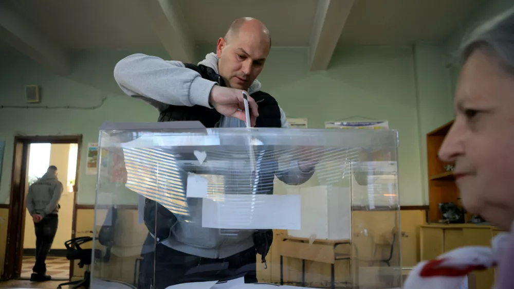 A man casts his ballot during an early election at a polling station in Sofia on Sunday, April 19, 2026. (AP Photo/Valentina Petrova)