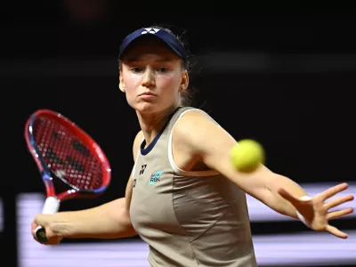 Kazakhstan's Jelena Rybakina returns a shot to Czech Republic's Karolina Muchova, during the women's final match at the Stuttgart Open tennis tournament, in Stuttgart, England, Sunday, April 19, 2026. (Marijan Murat/dpa via AP)