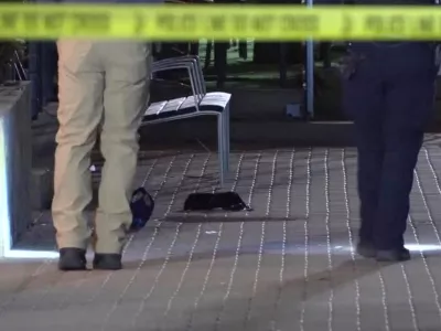 This image made from video provided by KCRG shows Iowa City police officers working the scene of a downtown shooting near the University of Iowa campus on Sunday, April 19, 2026. (KCRG via AP)