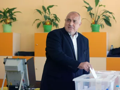 Former Prime Minister Boyko Borissov casts his vote in a polling station in Bankya, Bulgaria, Sunday, April 19, 2026, during early parliamentary elections. (AP Photo/Valentina Petrova)