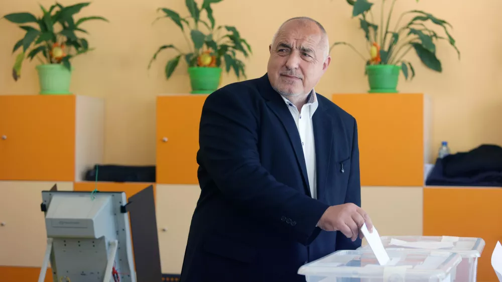 Former Prime Minister Boyko Borissov casts his vote in a polling station in Bankya, Bulgaria, Sunday, April 19, 2026, during early parliamentary elections. (AP Photo/Valentina Petrova)
