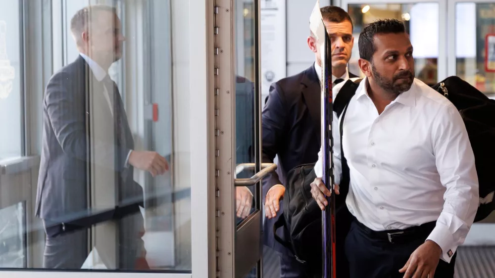 FBI Director Kash Patel walks to the locker room ahead of the annual lawmakers vs. lobbyist Congressional Hockey Challenge charity hockey game at MedStar Capitals Iceplex on Thursday, March 26, 2026, in Arlington, Va. (AP Photo/Tom Brenner)