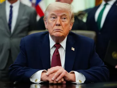President Donald Trump listens in the Oval Office of the White House, Saturday, April 18, 2026, in Washington. (AP Photo/Julia Demaree Nikhinson)