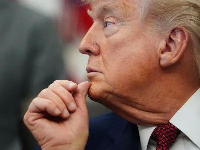 President Donald Trump listens to speeches before signing an executive order in the Oval Office of the White House, Saturday, April 18, 2026, in Washington. (AP Photo/Julia Demaree Nikhinson)