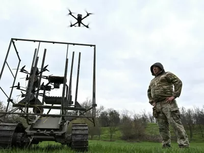 Ukrainian servicemen launch radio controlled and optic fibre controlled FPV-drones from an unmanned ground vehicle during testing at a training ground near a front line, amid Russia's attack on Ukraine, in Zaporizhzhia region, Ukraine April 10, 2026. REUTERS/Stringer