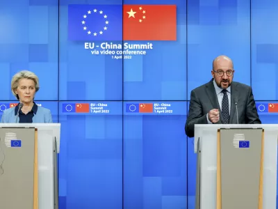 European Commission President Ursula von der Leyen, left, and European Council President Charles Michel speak during a media conference at the end of an EU China summit at the European Council building in Brussels, Friday, April 1, 2022. (AP Photo/Olivier Matthys)