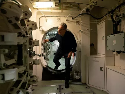 British Prime Minister Keir Starmer moves through a hatch on a Vanguard-class submarine, in Helensburgh, Scotland, Britain, April 18, 2026. Simon Dawson/UK MoD Crown Copyright/Handout via REUTERS ATTENTION EDITORS - THIS IMAGE HAS BEEN SUPPLIED BY A THIRD PARTY TPX IMAGES OF THE DAY