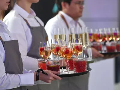 Waitress, service staff in the restaurant industry at work, tray with drinks. Waiter, female, woman, man?,Image: 1047842755, License: Rights-managed, Restrictions: GERMANY OUT, Model Release: no