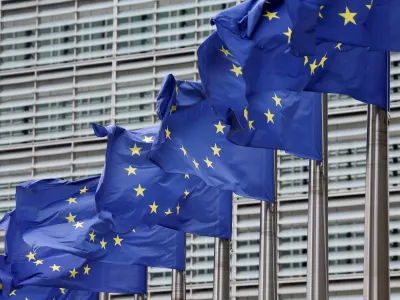 FILE PHOTO: European Union flags flutter outside the EU Commission headquarters in Brussels, Belgium July 16, 2025. REUTERS/Yves Herman/File Photo