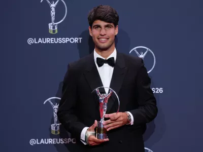 Carlos Alcaraz poses with his Laureus World Sportsman of the Year award during the 2026 Laureus World Sports Awards ceremony in Madrid, Spain, Monday, April 20, 2026. (AP Photo/Manu Fernandez)