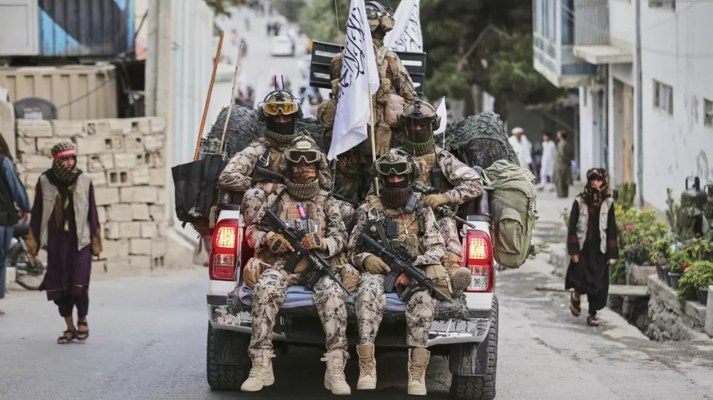 Taliban fighters parade in the streets during the celebrations marking the fourth anniversary of the U.S. withdrawal and the start of Taliban rule in Kabul, Afghanistan, Friday, Aug. 15, 2025. (AP Photo/Siddiqullah Alizai)