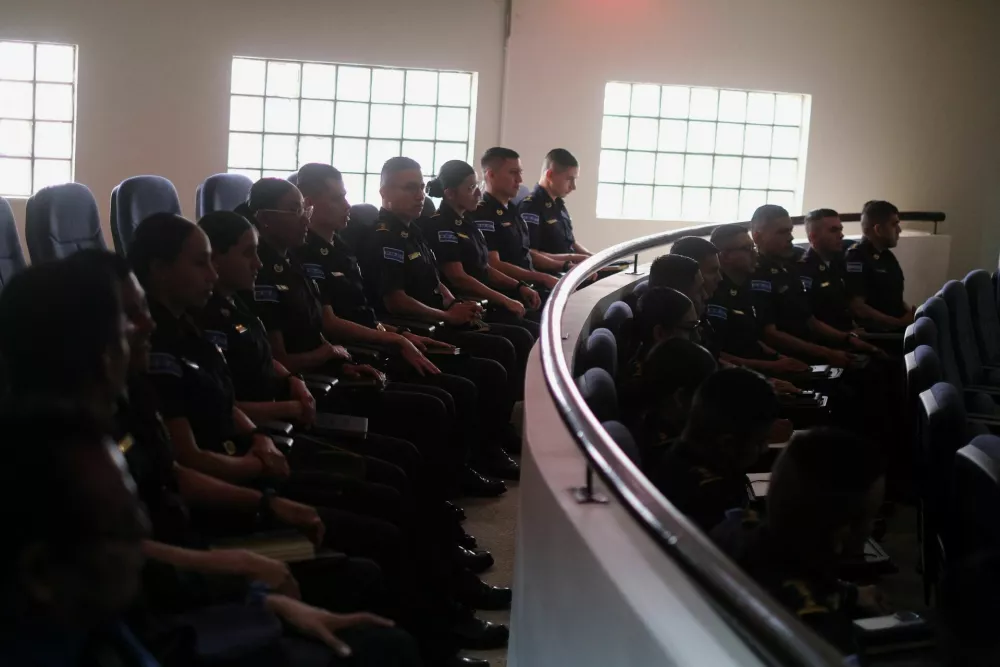 Police Academy cadets wait for an open hearing by El Salvador prosecutors against 486 members of Mara Salvatrucha, also known as MS-13 gang, who are accused of more than 47,000 crimes committed between 2012 and 2022, according to a statement from the Attorney General's Office, at the Judicial Center Against Organized Crime in Soyapango, El Salvador April 21, 2026. REUTERS/Jose Cabezas