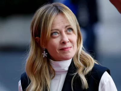 Italian Prime Minister Giorgia Meloni reacts as she waits for the arrival of Kenya's President William Ruto at Chigi Palace, in Rome, Italy, April 20, 2026. REUTERS/Remo Casilli
