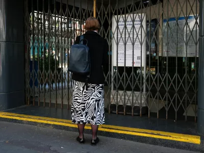 A woman looks at an information board outside a closed Covent Garden underground station during 24-hour tube strikes represented by the RMT union in dispute with TFL over working patterns, in London, Britain, April 22, 2026. REUTERS/Hannah McKay