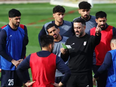 Soccer Football - International Friendly - Iran Training - Huseyin Aygun Football Center, Antalya, Turkey - March 25, 2026 Iran's Hossein Kanaani, Hossein Abraghouei and other teammates with assistant coach Saeed Alhoei during training REUTERS/Umit Bektas