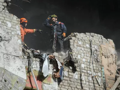 Rescuers works at a site of an apartment building hit by a Russian drone strike, amid Russia's attack on Ukraine, in Dnipro, Ukraine April 23, 2026. REUTERS/Stringer