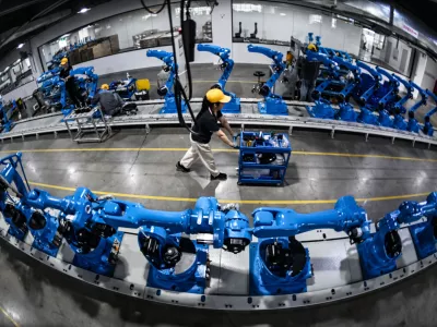 CHENGDU, CHINA - APRIL 08: Workers assemble industrial robots at Chengdu CRP Robot Technology Co., Ltd. on April 8, 2026 in Chengdu, Sichuan Province of China. (Photo by VCG/VCG)No Use China.