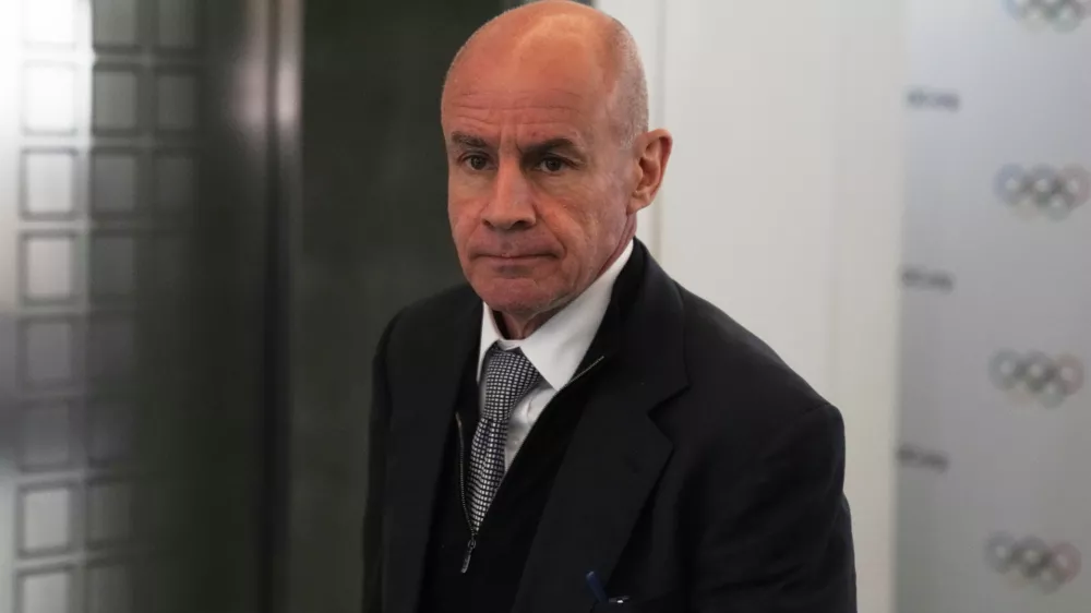 FILE - Candidate to the presidency of the International Olympic Committee Johan Eliasch arrives at the mixed zone during a break of the 144th session, which will elect the new IOC President, in Costa Navarino, western Greece, March 19, 2025. (AP Photo/Thanassis Stavrakis, File)