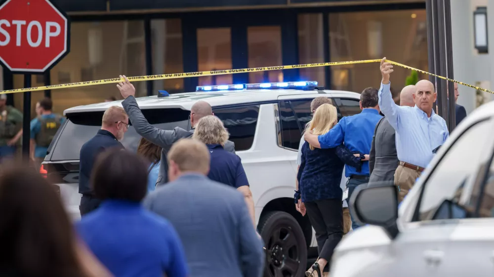 Police and officials respond to a mass shooting at the Mall of Louisiana, Thursday, April 23, 2026, in Baton Rouge, La. (AP Photo/Matthew Hinton)