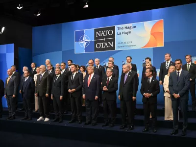Netherlands' Prime Minister Dick Schoof, front row from fifth left, NATO Secretary General Mark Rutte, US President Donald Trump, Britain's Prime Minister Keir Starmer and Turkey's President Recep Tayyip Erdogan pose with NATO country leaders for a family photo during the NATO summit in The Hague, Netherlands, Wednesday, June 25, 2025. (Ben Stansall/Pool Photo via AP)