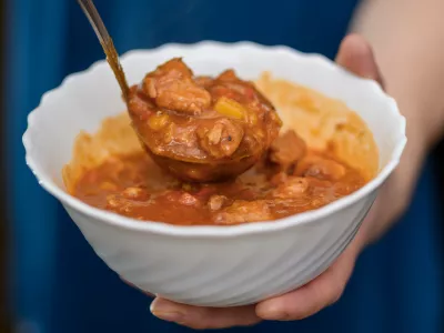 Ladle the meat stew with vegetables into a bowl