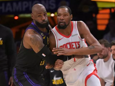 Apr 21, 2026; Los Angeles, California, USA; Los Angeles Lakers forward LeBron James (23) defends Houston Rockets forward Kevin Durant (7) in the first half of game two of the first round of the 2026 NBA Playoffs against the Houston Rockets at Crypto.com Arena. Mandatory Credit: Jayne Kamin-Oncea-Imagn Images