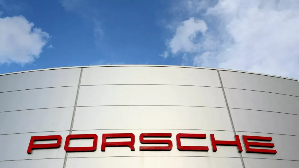 FILE PHOTO: A logo of Porsche is seen outside a Porsche car dealer in Brussels, Belgium March 13, 2023. REUTERS/Yves Herman/File Photo/File Photo