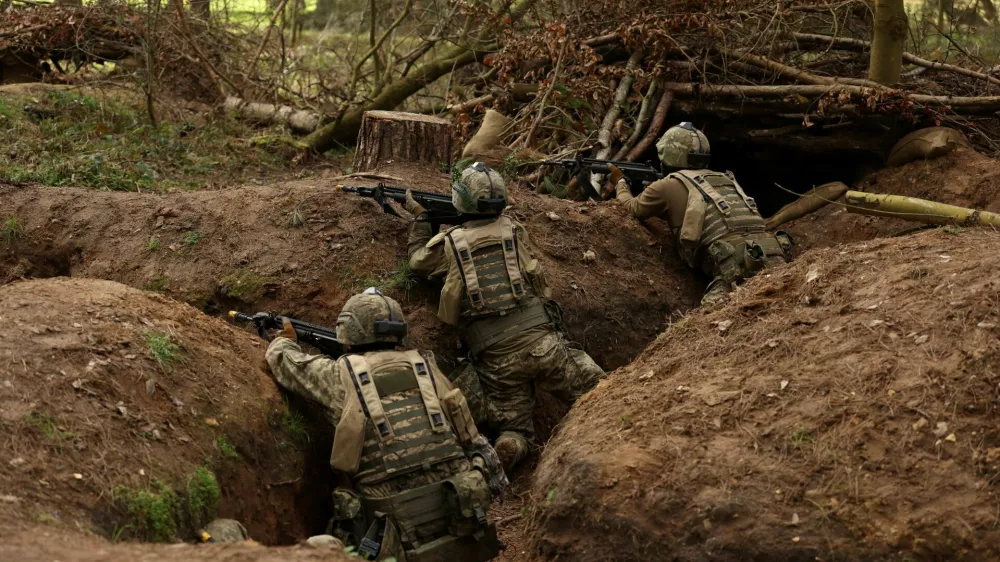 Ukrainian soldiers take part in a final tactical exercise on the fourth anniversary of Russia's full-scale invasion of Ukraine, held at a British Army training camp in East Anglia, Britain, February 24, 2026. REUTERS/Chris Radburn