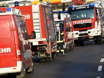 Many fire engines on a street during a large fire-fighting mission in Upper Austria - the fire departments in Austria are largely organized on a voluntary basis - their members come on volunteer missions