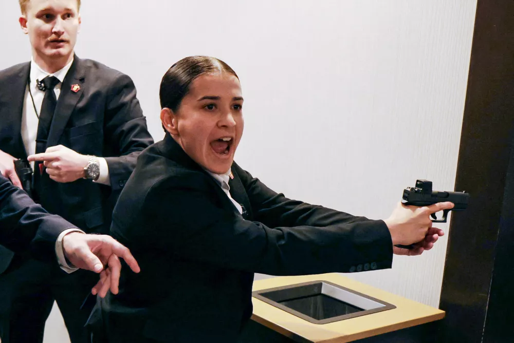 Security officials respond as a shooter opens fire during the annual White House Correspondents' Association dinner in Washington, D.C., U.S., April 25, 2026. REUTERS/Jonathan Ernst